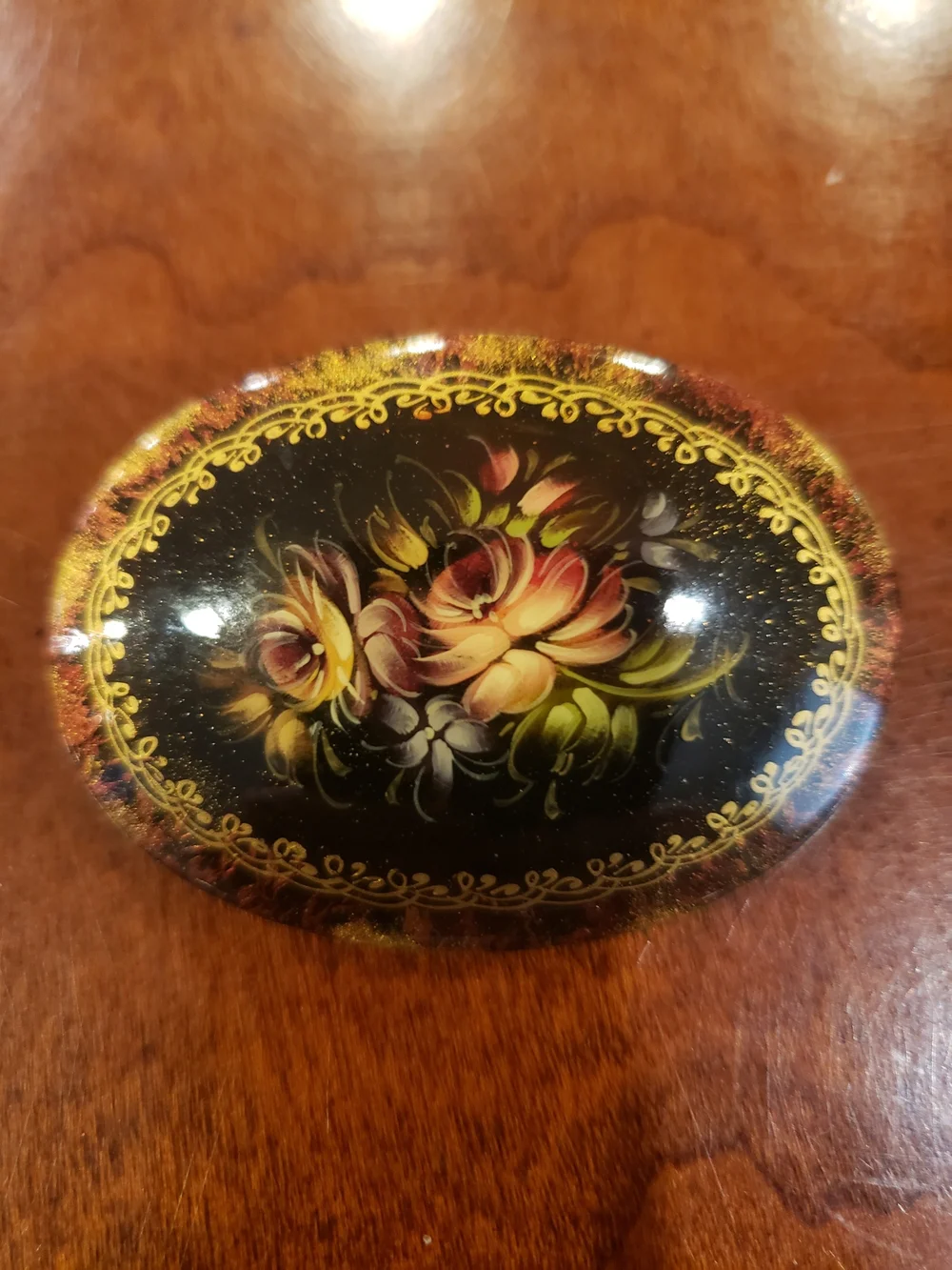 Vintage '96 Oval Black Floral Brooch with Gold Accents
